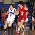 Rogers’ Branden Gentz, left, drives under pressure from Webb City’s Austin Daniel on Dec. 12 during ...
