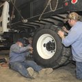 Gary DeShields, from left, Rodney Chadwell, and Jimmy Green, all with the Bentonville Street Departm...