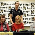 Bentonville volleyball coach Michelle Coens, top, says a few words about senior outside hitter Danie...