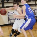 Elkins’ Maddi Grube drives around Mountainburg’s Taylor Morton in the first half Tuesday in Elkins.