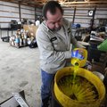 James Mosteller dumps antifreeze Wednesday at Washington County Household Hazardous Waste drop-off f...