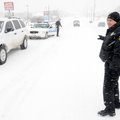 Bentonville Police Officer Steve Vera keeps keeps a southbound lane open on North Walton Blvd. while...