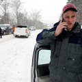 Shawn Keller calls a friend to pick him up Friday, Jan. 29 after his vehicle slid off the road on th...