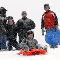 Theo Hamrin, 8, sleds down a hill at Country Club Golf Course as Shane Stewart, left, Jaylen Stewart...
