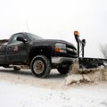 A snow plow with the Bella Vista Property Owners Association's road department clears a lane on Lanc...