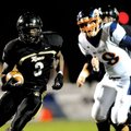Bentonville running back Courtney Haskell races for a first down during the first half of the Tigers...