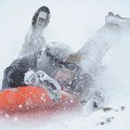 Heath McCracken, 14, rides down a hill while sledding with friends Logan Blalock and Coleson Young o...