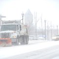 A Fayetteville Transportation Division plow truck heads south on North College Avenue Friday, Jan. 2...