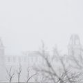 Old Main on the University of Arkansas campus is scene through heavy snow Friday January 29 in Fayet...