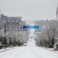 Dickson Street in Fayetteville is sparce Friday afternoon as many businesses and shops close due to ...