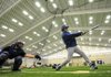 Rogers High senior Alex Shelor takes batting practice with junior catcher Jake Rylee behind the plate during Wednesday’s workout at Rogers High. The Mounties’ first game of the season is March 6.
