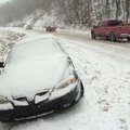 Traffic moves along Arkansas 12 one mile east of Rogers on Friday morning. Vehicle traffic was minim...