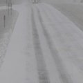 Traffic moves along the southbound land of Interstate 540 Friday as heavy snow begins to fall. Overn...