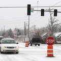 Traffic at Elm Springs Road and 40th street work through the intersection using a temporary four way...