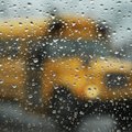 CHILLING EFFECT - Students load buses at Springdale High School as rain moves in Thursday afternoon....