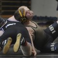 Bentonville’s Sean Johnson, right, holds onto Fayetteville’s Marshall McComas during a Jan. 21 wrest...