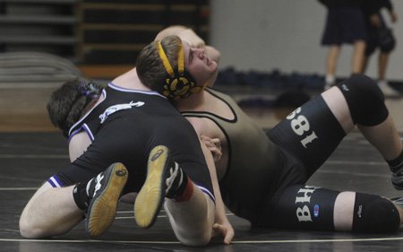 Bentonville’s Sean Johnson, right, holds ...