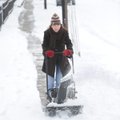 Juli Dorrough, a member of St. Paul's Episcopal Church, uses a snow blower to clear snow and ice fro...