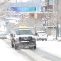A City of Fayetteville Transportation Division truck spreads a brine solution on West Dickson Street...
