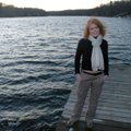 Paula Henry stands on a dock at Avalon Lake Dam in Bella Vista, her favorite spot.