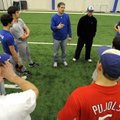 Rogers High baseball coach Matt Melson talks to his players before the start of their practice Wedne...
