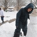 Bentonville Water Department employee Dustin Youngblood uses a street sweeper to clear a public park...