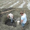 FILE — Bill Moore, left, puts promising dirt with gravel into a bucket from a four foot deep hole wi...
