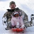 FROSTED VIEWS - Jason McGarrah sleds down a hill with his niece, Stormy McGarrah, 4, on Saturday at ...