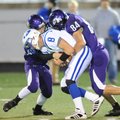 Rogers junior quarterback Graham Parker (8) is sacked by Fayetteville junior linebacker Colby Mhoon,...