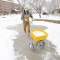 WINTER WONDERLAND - Randy Moore with Fayetteville’s Parks and Recreation Division uses a broadcast s...