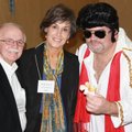 Scrabble Wars volunteer Dick and Nancy Trammel, from left, talk with Elvis at the Literacy Council o...
