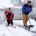 Rick Coleman, from right, and sons Isaiah, 13, Zachary, 14, and Noah, 7, shovel the driveway Saturda...