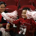 Deysi Chicas or Rogers (cq) watches as her son Carlos,4, cheers as the University of Arkansas Women...