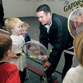 Jeff Stone, a tennis pro with Pinnacle Country Club in Rogers, talks to a group Jan. 21 during a ten...