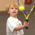  Henry Colebank, 5, of Rogers, hits a tennis ball during the tennis program.