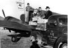 Jay Frizzo, from left, Frank Rust, Howard Backus and C. Jimmie Carter ready the first shipment of broilers to Alaska from the Rogers Airport in November 1949. Carter was president of the Rogers Airport Corporation.

