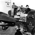 Jay Frizzo, from left, Frank Rust, Howard Backus and C. Jimmie Carter ready the first shipment of br...