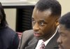 In this file photo, Willard Proctor Jr., left, confers with his attorney Austin Porter Jr. before the start of Proctor's hearing before the Arkansas Judicial Discipline and Disability Commision.