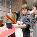 SAMPLE SMOOTHIES - Tyler Gurganus, 9, center, and Silas Myane, 9, right, try chocolate-banana smooth...