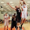 RED’DOG ROUTE - Rogers Heritage’s Nick Jordan shoots the ball over Springdale’s Joseph Kellogg durin...