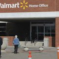 People enter and leave the Wal-Mart Home Office in Bentonville on Wednesday. 
