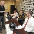 Bentonville football coach Barry Lunney talks with seniors Hayden Boydston, Jon-Mark Holden, and Cha...