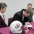 Springdale senior Chris Clinard signs a letter of intent to play football for Evangel University as ...