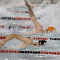 Fayetteville’s Peter Du, bottom, competes in the 50-yard freestyle at the Jones Center for Families ...