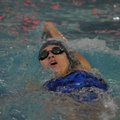 Springdale Har-Ber’s Lexie Keller swims the backstroke in the 200 yard individual medley Thursday at...