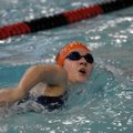 Rogers Heritage’s Kanon Steen swims in the girls 200-yard freestyle during the Springdale Swim Meet ...