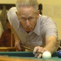 RAINY DAY EIGHT-BALL - Lyn Louden of Prairie Creek lines up a shot Thursday while playing eight-ball...