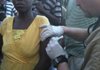 Dr. Lance Faddis gives a shot to a Haitian woman. Faddis was in Haiti with a group from the Rogers First Baptist Church helping victims of the recent earthquake in the country.
