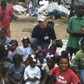 John Caubble, executive pastor at Rogers’ First Baptist Church, gave out gifts of hair ribbons and b...