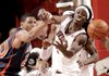 Arkansas sophomore Courtney Fortson (right) and Auburn sophomore Frankie Sullivan go after a rebound during the first half Saturday at Bud Walton Arena in Fayetteville.